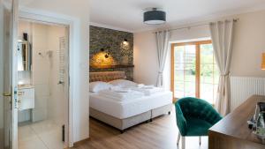 Posteľ alebo postele v izbe v ubytovaní Apartamenty Kapitańskie