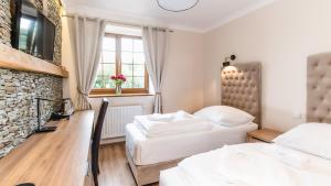 Posteľ alebo postele v izbe v ubytovaní Apartamenty Kapitańskie