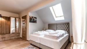 Posteľ alebo postele v izbe v ubytovaní Apartamenty Kapitańskie