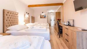 Posteľ alebo postele v izbe v ubytovaní Apartamenty Kapitańskie