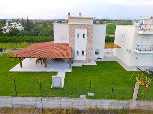 an aerial view of a house with a roof at Mythic Villas in Epanomi