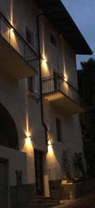 a building with lights on the side of it at Castle Rhythm Inn in Arco