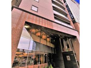 a building with a large window on the side of it at Mars Garden Hotel Hakata - Vacation STAY 48738v in Fukuoka