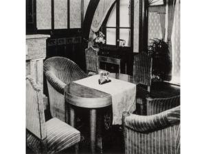 a black and white photo of a table and chairs at Dogo Onsen Funaya - Vacation STAY 54201v in Matsuyama