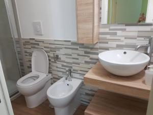 a bathroom with a toilet and a sink at Rega Holiday House in Naples +47 photos