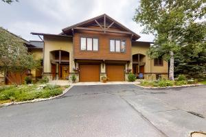 a wooden house with a driveway in front of it at Waterstone 2748 in Steamboat Springs
