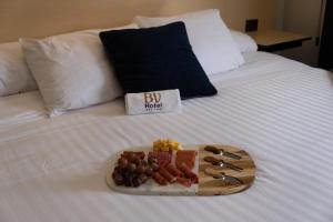 Postel nebo postele na pokoji v ubytování BV Hotel Atlixco