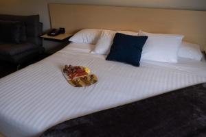 Postel nebo postele na pokoji v ubytování BV Hotel Atlixco