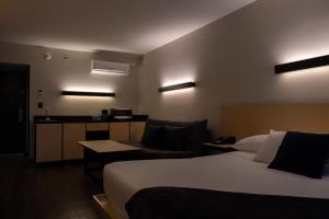 Postel nebo postele na pokoji v ubytování BV Hotel Atlixco