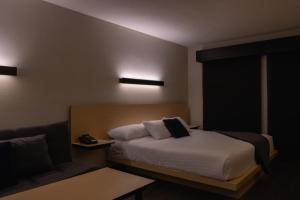Postel nebo postele na pokoji v ubytování BV Hotel Atlixco