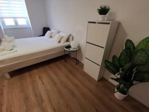Posteľ alebo postele v izbe v ubytovaní Marina Rijeka Center apartments