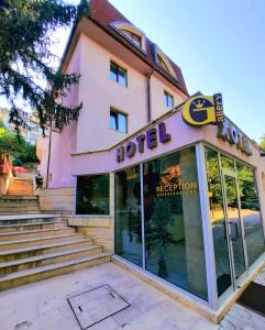 a hotel with a sign on the front of it at Family Art Hotel Gallery in Pleven