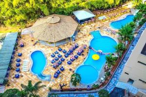 A piscina localizada em GOLDEN DOLPHIN Resort - Grand & Express - Caldas Novas - COM TV A CABO - Aguas Termais ou nos arredores