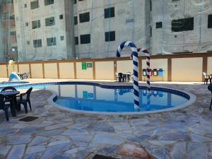 A piscina localizada em GOLDEN DOLPHIN Resort - Grand & Express - Caldas Novas - COM TV A CABO - Aguas Termais ou nos arredores