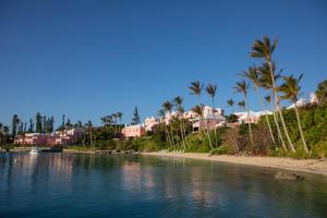 a large body of water with palm trees at Cambridge Beaches Resort and Spa in Somerset