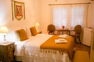 Ένα ή περισσότερα κρεβάτια σε δωμάτιο στο Pouso do Bichinho 2
