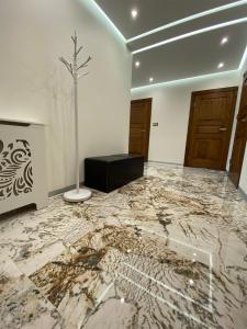Televízia a/alebo spoločenská miestnosť v ubytovaní Apartament Szot