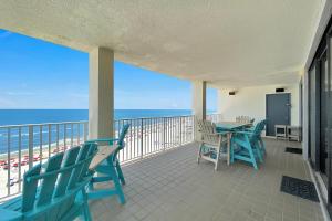 a balcony with a table and chairs and the ocean at Windward Pointe Unit 901 in Orange Beach