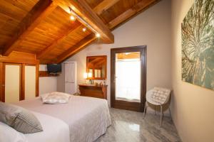 Postel nebo postele na pokoji v ubytování b&b Al Castel