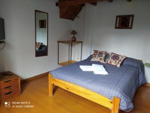 Postel nebo postele na pokoji v ubytování Casa Campo