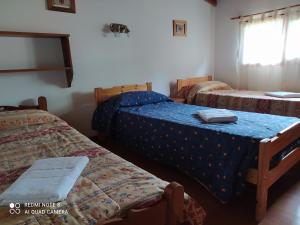 Postel nebo postele na pokoji v ubytování Casa Campo