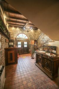 a large kitchen with a counter and a staircase at Konitsa Panorama in Konitsa