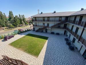 an aerial view of a building with a grass courtyard at AURUM-hotel in Berdyansʼk
