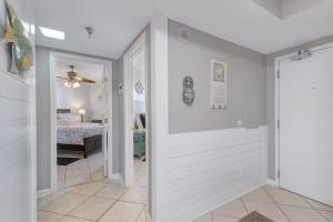 a hallway with a door leading to a bedroom at Windward Point Unit 1004 in Orange Beach