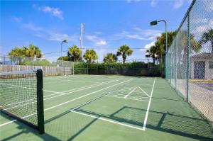 a tennis court with a net on top of it at Windward Point Unit 1004 in Orange Beach
