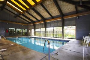 a large swimming pool in a building at Windward Point Unit 1004 in Orange Beach