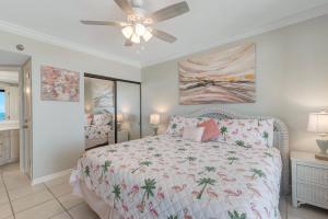 a bedroom with a bed and a ceiling fan at Windward Point Unit 1004 in Orange Beach
