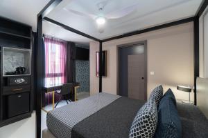 Кровать или кровати в номере Hotel Perla del Sur