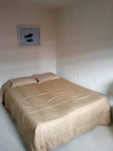 Säng eller sängar i ett rum på Casa do Fábio