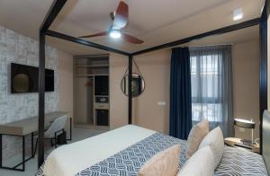 Кровать или кровати в номере Hotel Perla del Sur
