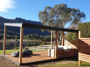 a gazebo with a view of a lake at Halls Gap Motel in Halls Gap