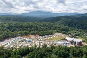 a large building with a lot of trees at Camp Margaritaville RV Resort & Lodge in Pigeon Forge