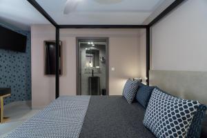 Кровать или кровати в номере Hotel Perla del Sur