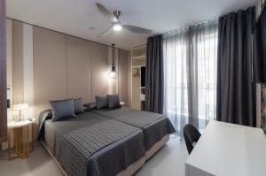 Кровать или кровати в номере Hotel Perla del Sur