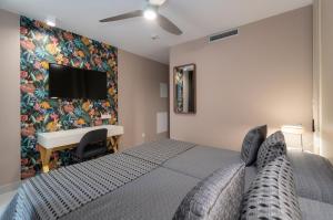 Кровать или кровати в номере Hotel Perla del Sur