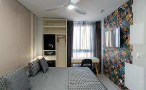 Кровать или кровати в номере Hotel Perla del Sur