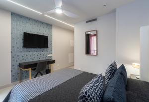 Телевизор и/или развлекательный центр в Hotel Perla del Sur