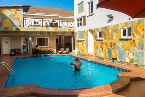 Bazén v ubytování Midindi Hotel nebo v jeho okolí