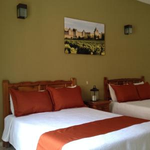Postel nebo postele na pokoji v ubytování Hotel Casa de Vino