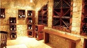 a wine cellar with a bunch of wine bottles at Ateron Suites Hotel & Spa in Amyntaio