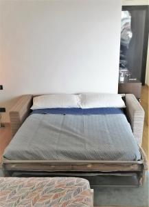 Łóżko lub łóżka w pokoju w obiekcie 616 Genova - Loft al Porto Antico