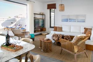 a living room with a couch and a table at Chris Le Mare Gold Luxury Villa in Protaras