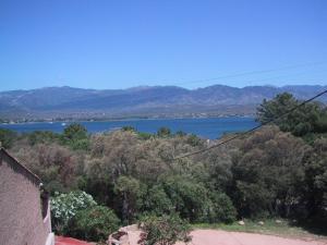 a view of a body of water from a house at Locations A Suara in Porto-Vecchio