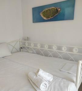 A bed or beds in a room at Anastasia's maison