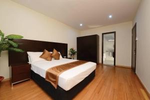 Uma cama ou camas num quarto em Timor Plaza Hotel & Apartments
