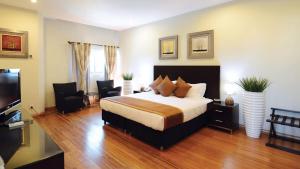 Uma televisão e/ou sistema de entretenimento em Timor Plaza Hotel & Apartments